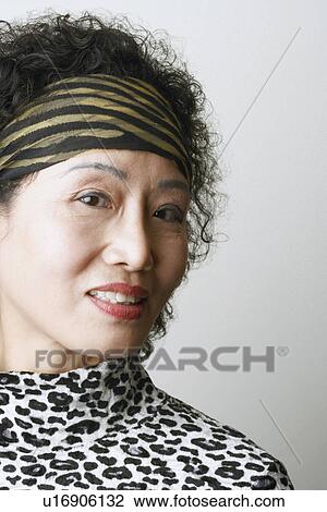 Close-up of a mature woman View Large Photo Image Stock Image - Close-up of a mature woman. Fotosearch