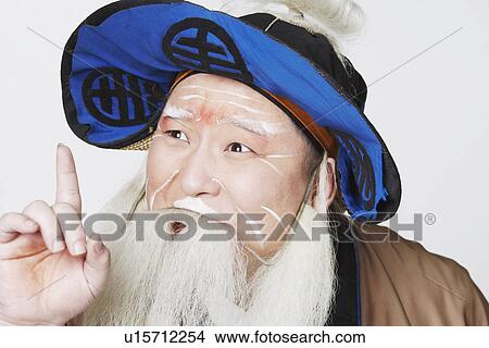 Picture - Close-up of a mid adult man pointing up. Fotosearch