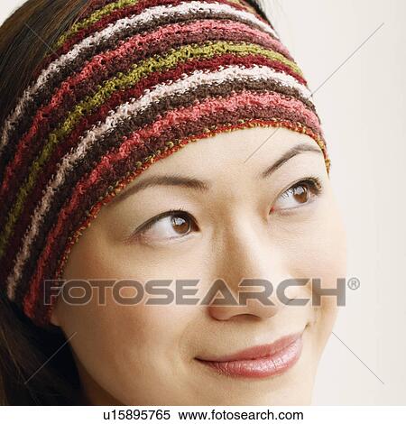 Close-up of a young woman smiling View Large Photo Image Stock Photography - Close-up of a young woman smiling. Fotosearch