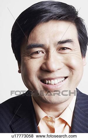 Stock Photo - Portrait of a businessman smiling. Fotosearch
