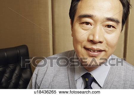 Portrait of a businessman smiling View Large Photo Image Stock Photography - Portrait of a businessman smiling. Fotosearch
