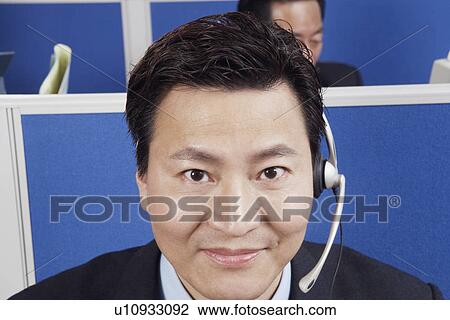 Portrait of a businessman wearing a headset View Large Photo Image Stock Image - Portrait of a businessman wearing a headset. Fotosearch