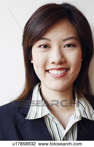 Stock Image - Portrait of a businesswoman smiling. Fotosearch