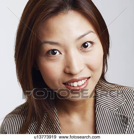 Stock Photo - Portrait of a businesswoman smiling. Fotosearch