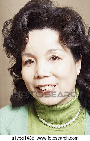 Stock Photography - Portrait of a businesswoman smiling. Fotosearch