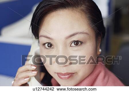 Portrait of a businesswoman talking on the telephone View Large Photo Image Stock Image - Portrait of a businesswoman talking on the telephone. Fotosearch