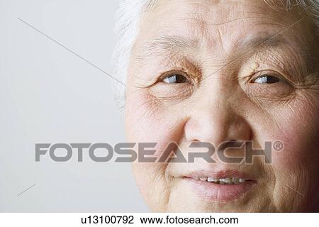 Portrait of a senior woman smiling View Large Photo Image Stock Image - Portrait of a senior woman smiling. Fotosearch
