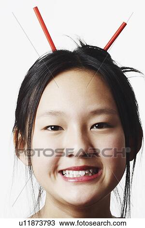 Portrait of a teenage girl clenching her teeth View Large Photo Image Stock Image - Portrait of a teenage girl clenching her teeth. Fotosearch