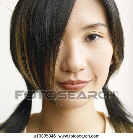 Portrait of a young woman posing View Large Photo Image Stock Photograph - Portrait of a young woman posing. Fotosearch