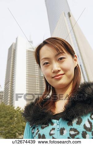 Stock Photo - Portrait of a young woman smiling. Fotosearch