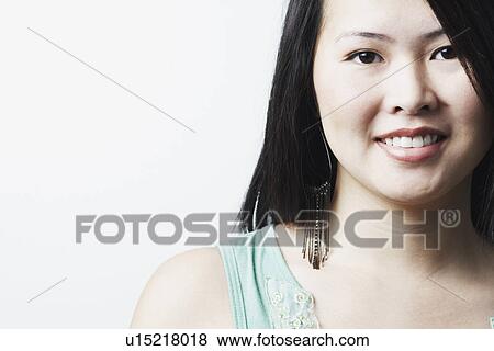 Stock Photo - Portrait of a young woman smiling. Fotosearch