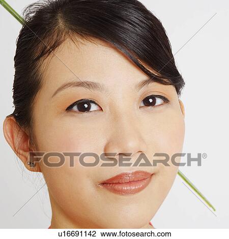 Stock Image - Portrait of a young woman. Fotosearch