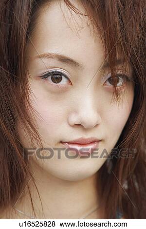 Stock Photo - Portrait of a young woman. Fotosearch