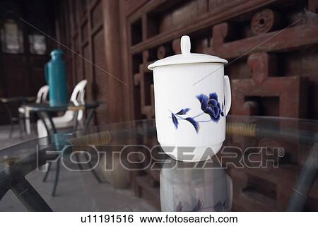 Close-up of a mug on the table in a restaurant View Large Photo Image Stock Photograph - Close-up of a mug on the table in a restaurant. Fotosearch
