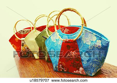 Close-up of four hand bags View Large Photo Image Stock Photo - Close-up of four hand bags. Fotosearch