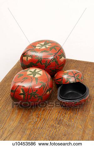 Close-up of three boxes on a desk View Large Photo Image Stock Photograph - Close-up of three boxes on a desk. Fotosearch
