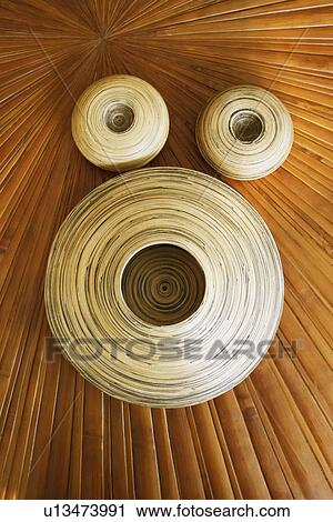 Close-up of three clay pots on a wooden base View Large Photo Image Stock Image - Close-up of three clay pots on a wooden base. Fotosearch