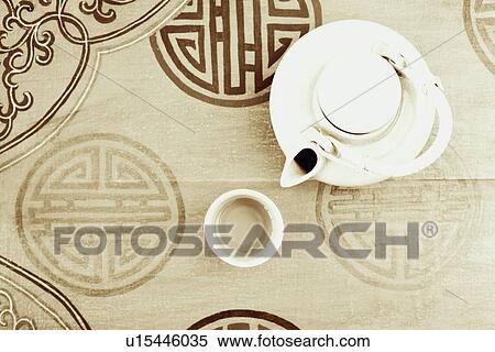 Stock Photography - High angle view of a teapot and a tea cup. Fotosearch