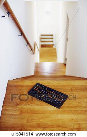 Picture - High angle view of an abacus on staircase. Fotosearch