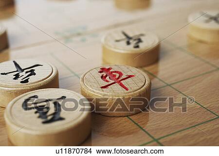 Picture - High angle view of Chinese chess pieces. Fotosearch