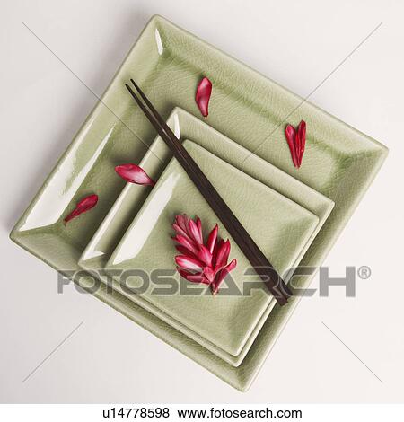 High angle view of flower petals and chopsticks in a plate View Large Photo Image Stock Photo - High angle view of flower petals and chopsticks in a plate. Fotosearch