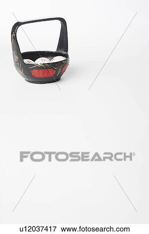Stock Photo - High angle view of steamed dumplings in a basket. Fotosearch