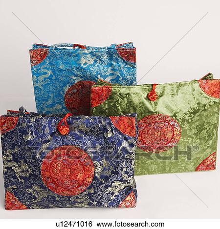 Stock Photograph - High angle view of three hand bags. Fotosearch