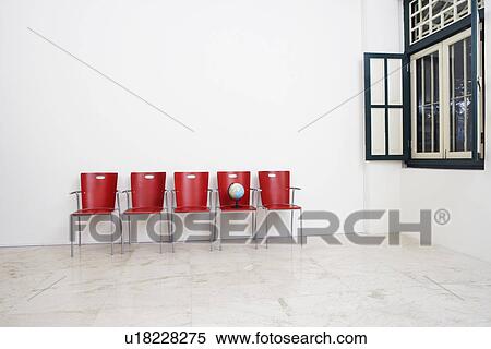 Office chairs and a globe in an office View Large Photo Image Stock Photography - Office chairs and a globe in an office. Fotosearch