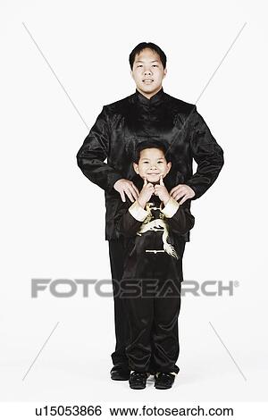 Stock Photograph - Portrait of a father and his son smiling together. Fotosearch