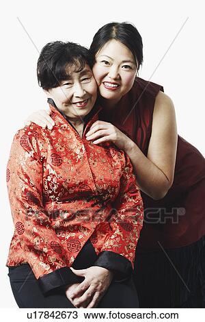 Portrait of a mother and her daughter smiling View Large Photo Image Stock Image - Portrait of a mother and her daughter smiling. Fotosearch