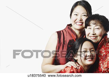 Stock Image - Portrait of a mother with her daughter and granddaughter smiling. Fotosearch