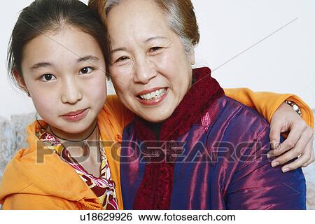 Stock Photograph - Portrait of a young woman with her mother. Fotosearch