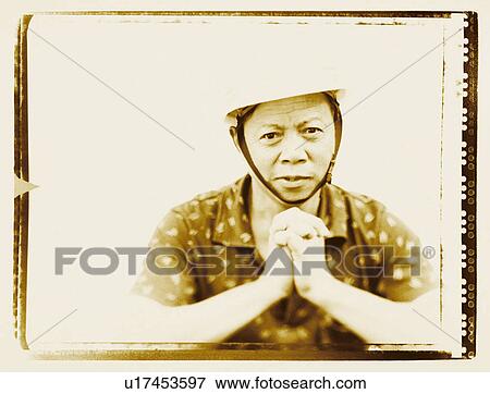 Stock Photo - Portrait of a mature man looking pensive. Fotosearch