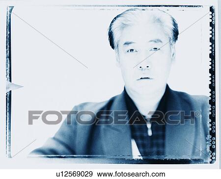Stock Photo - Portrait of a senior man looking serious. Fotosearch
