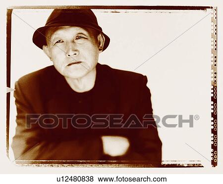 Portrait of a senior man with his arms crossed View Large Photo Image Stock Photo - Portrait of a senior man with his arms crossed. Fotosearch
