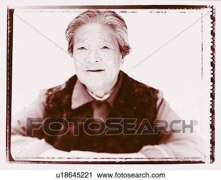 Stock Image - Portrait of a senior woman smiling . Fotosearch