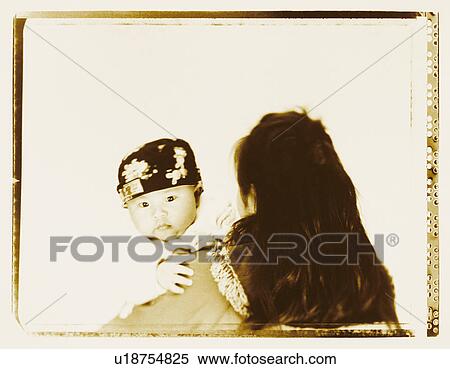 Rear view of a mother carrying her son View Large Photo Image Stock Photography - Rear view of a mother carrying her son. Fotosearch