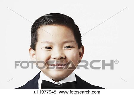 Stock Photography - Close-up of a boy smiling. Fotosearch