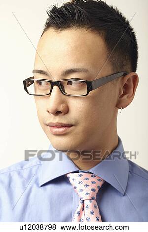 Close-up of a businessman looking sideways View Large Photo Image Stock Photo - Close-up of a businessman looking sideways. Fotosearch