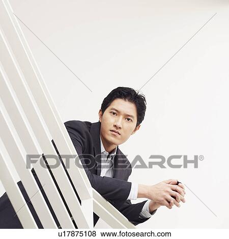 Stock Photo - Portrait of a businessman looking serious. Fotosearch