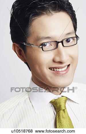 Stock Photo - Portrait of a businessman smiling. Fotosearch