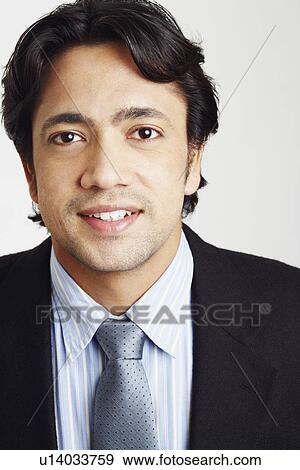 Stock Photo - Portrait of a businessman smiling. Fotosearch