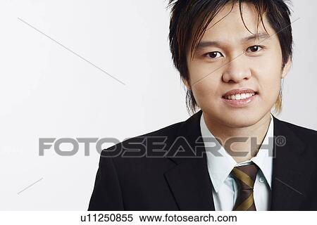 Stock Photography - Portrait of a businessman smiling. Fotosearch