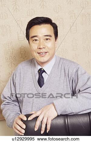 Stock Photography - Portrait of a businessman smiling. Fotosearch
