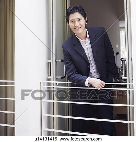 Stock Photography - Portrait of a businessman smiling. Fotosearch