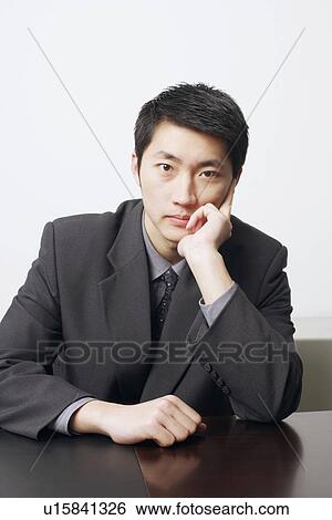 Portrait of a businessman thinking View Large Photo Image Stock Photograph - Portrait of a businessman thinking. Fotosearch
