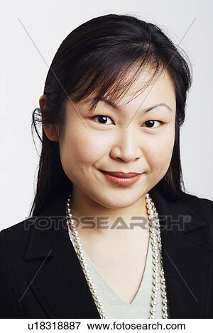 Stock Photo - Portrait of a businesswoman smiling. Fotosearch