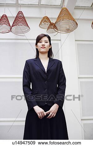 Stock Photo - Portrait of a businesswoman standing. Fotosearch