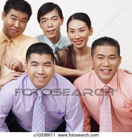 Stock Image - Portrait of a group of business executives posing. Fotosearch
