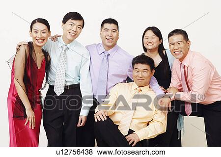 Stock Photo - Portrait of a group of business executives posing. Fotosearch